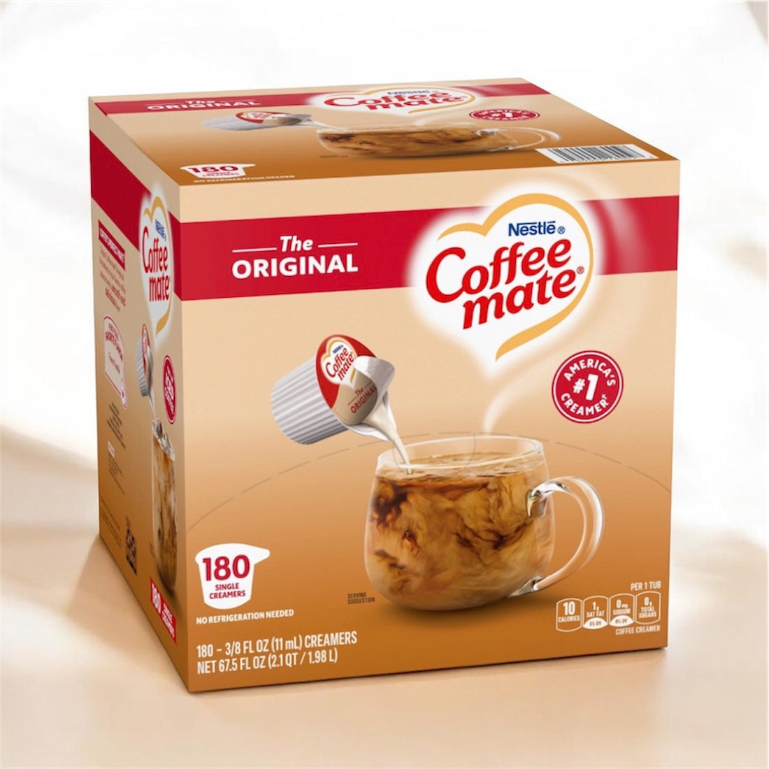 Box of Nestle Coffee-mate creamer with a glass of coffee in the background