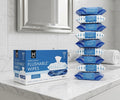 Box of flushable wipes on a bathroom counter with multiple packages stacked behind it.