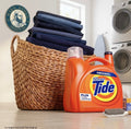 Orange Tide Original liquid detergent jug with blue cap and 152 loads label