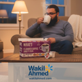   بِسْمِ ٱللَّٰهِ ٱلرَّحْمَٰنِ ٱلرَّحِيمِ
Wakil Ahmed sitting on a couch drinking coffee with a box of Maud's Flavored Coffee Variety Pack in front of him, with Wakil Ahmed logo visible.