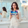 Deepika Padukone holding a box of Always Maxi pads in a bathroom setting with Wakil Ahmed branding.