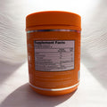 Orange supplement container with 'Supplement Facts' label on a white background