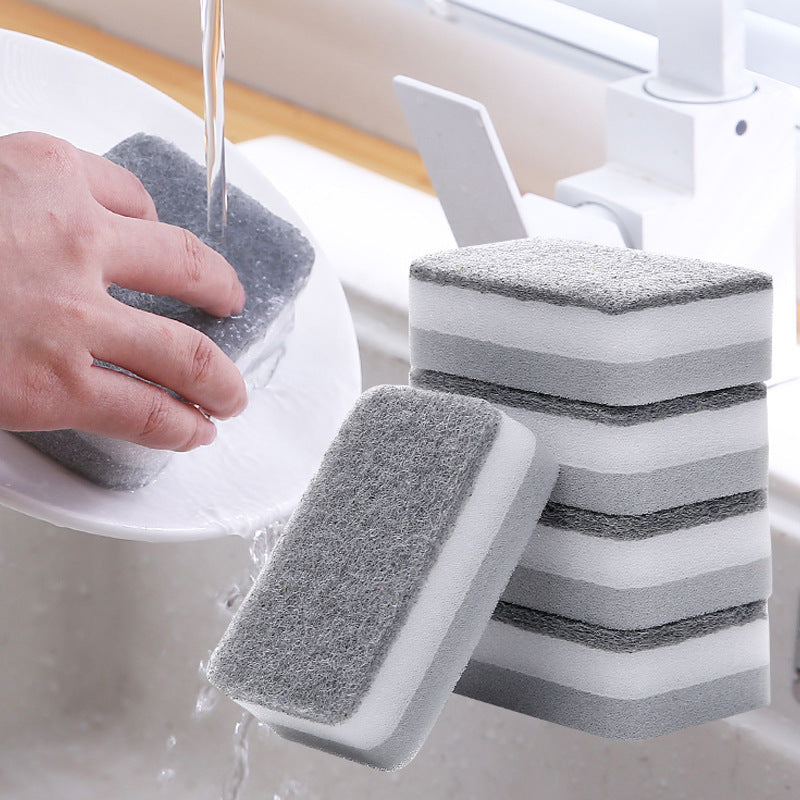 Double-sided cleaning sponges in assorted colors, ideal for household scouring and effective dirt removal.